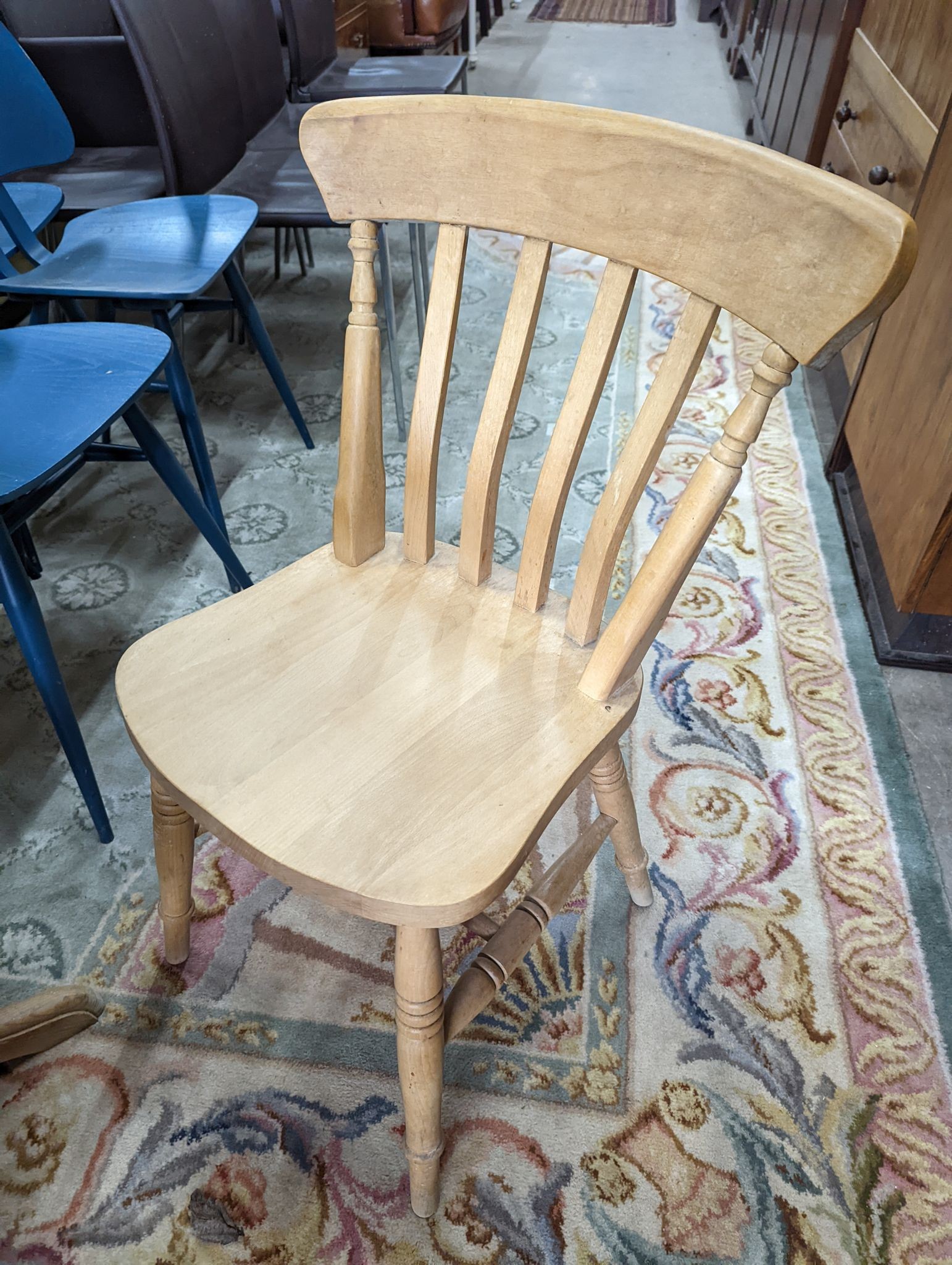 A Victorian style circular pine breakfast table, diameter 105cm, height 74cm, together with four Victorian style beech lathe back kitchen chairs